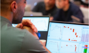 Trader executing orders on live charts